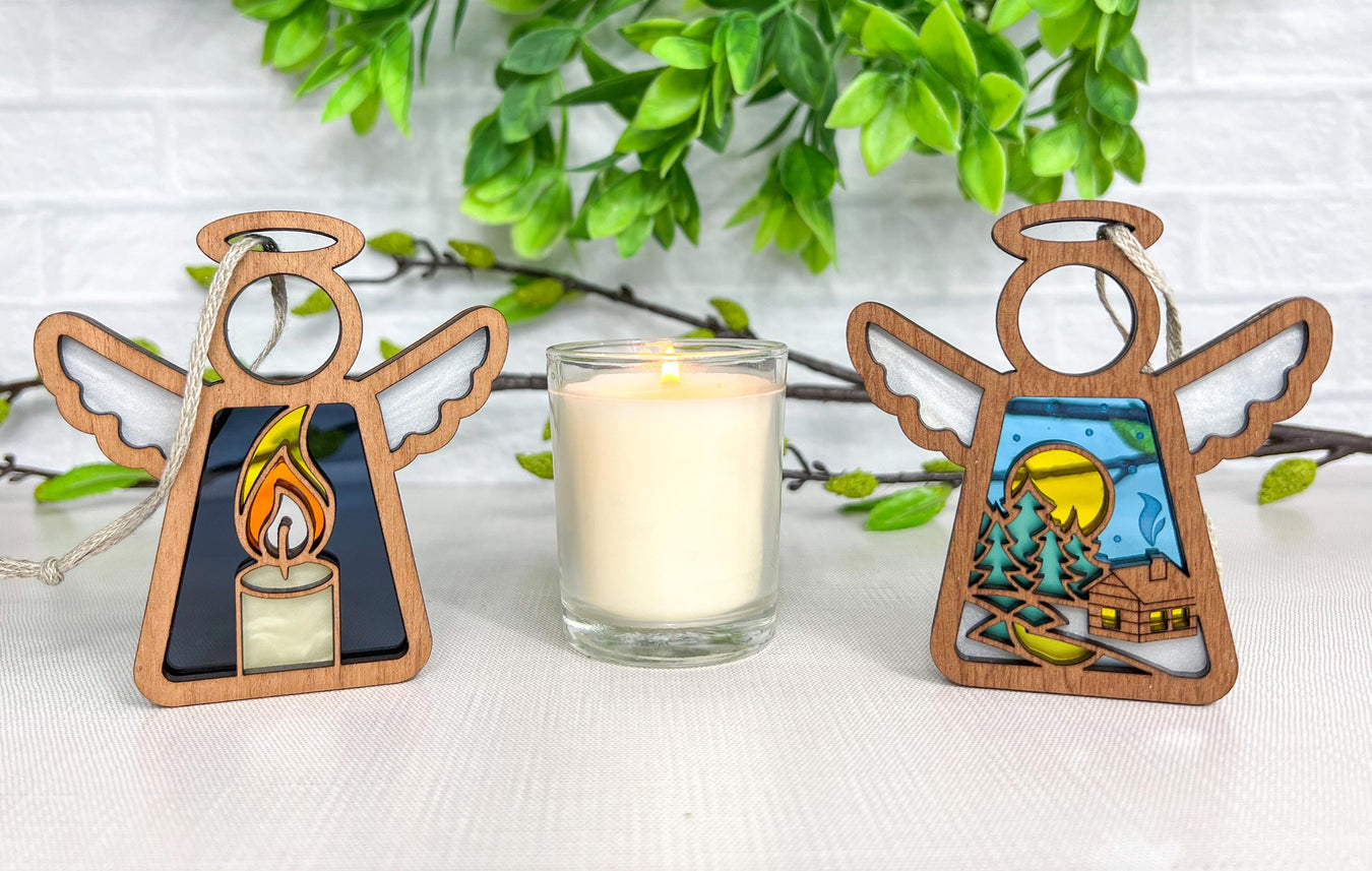 Mother’s Angels® ornaments, featuring the Burning Candle and Warm Welcome designs, displayed as bereavement gifts and celebration of life decorations, evoke warmth and remembrance.