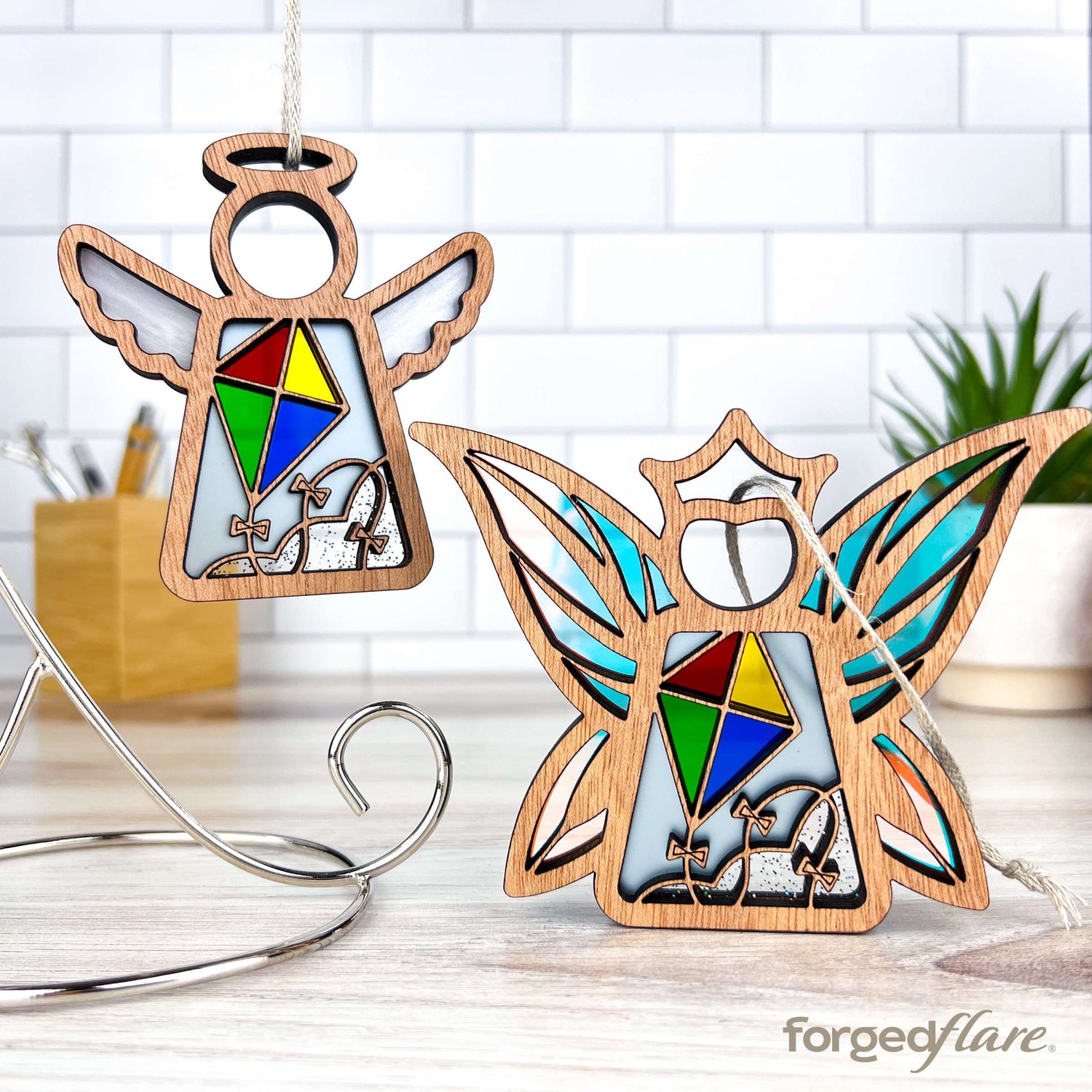 Part of the Fly a Kite for Charity collection, these Mother’s Angels® and fairy ornaments by Forged Flare® feature a colorful kite design. Sales support Youth Villages in Memphis, Tennessee, a nonprofit aiding children, exemplifying the spirit of donating to charity.