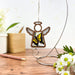 Swallowtail butterfly ornament suspended in a warm indoor setting, ideal for butterfly decorations for hanging or as heartfelt memorial gift ideas.