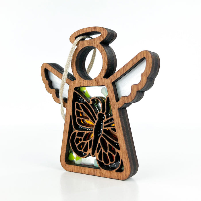 A Mother’s Angels® ornament by Forged Flare® with a unique angel shape and a Monarch butterfly motif, perfect as an elegant addition to butterfly party decorations or as a special Father's Day gift for a new dad.