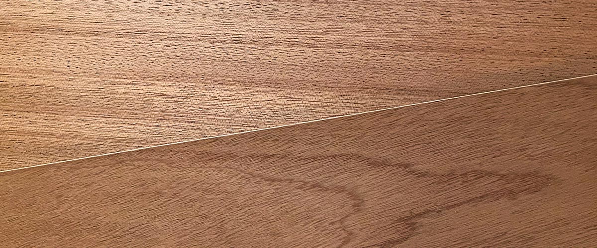 Close-up of sapele wooden wood showing its unique grain designs.