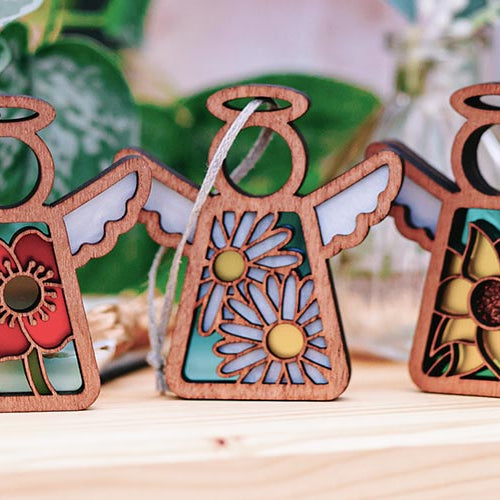 Beautiful flower angel ornaments — a poppy, a daisy and a sunflower.
