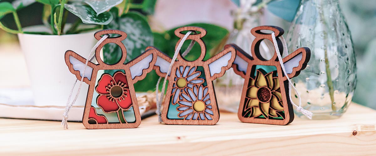 Beautiful flower angel ornaments — a poppy, a daisy and a sunflower.