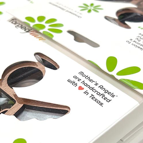 Forged Flare® handmade angel ornaments with green floral packaging, showcasing a wooden Mother’s Angels® design for meaningful decor.