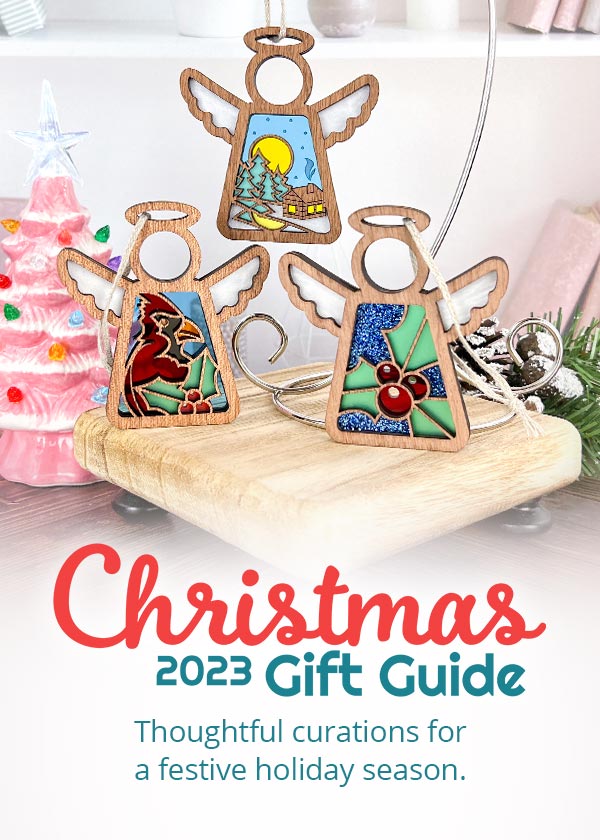 Christmas 2023 Gift Guide. Thoughtful curations for a festive holiday season. Winter Cardinal, Warm Welcome and Holly Mother's Angels holiday display.