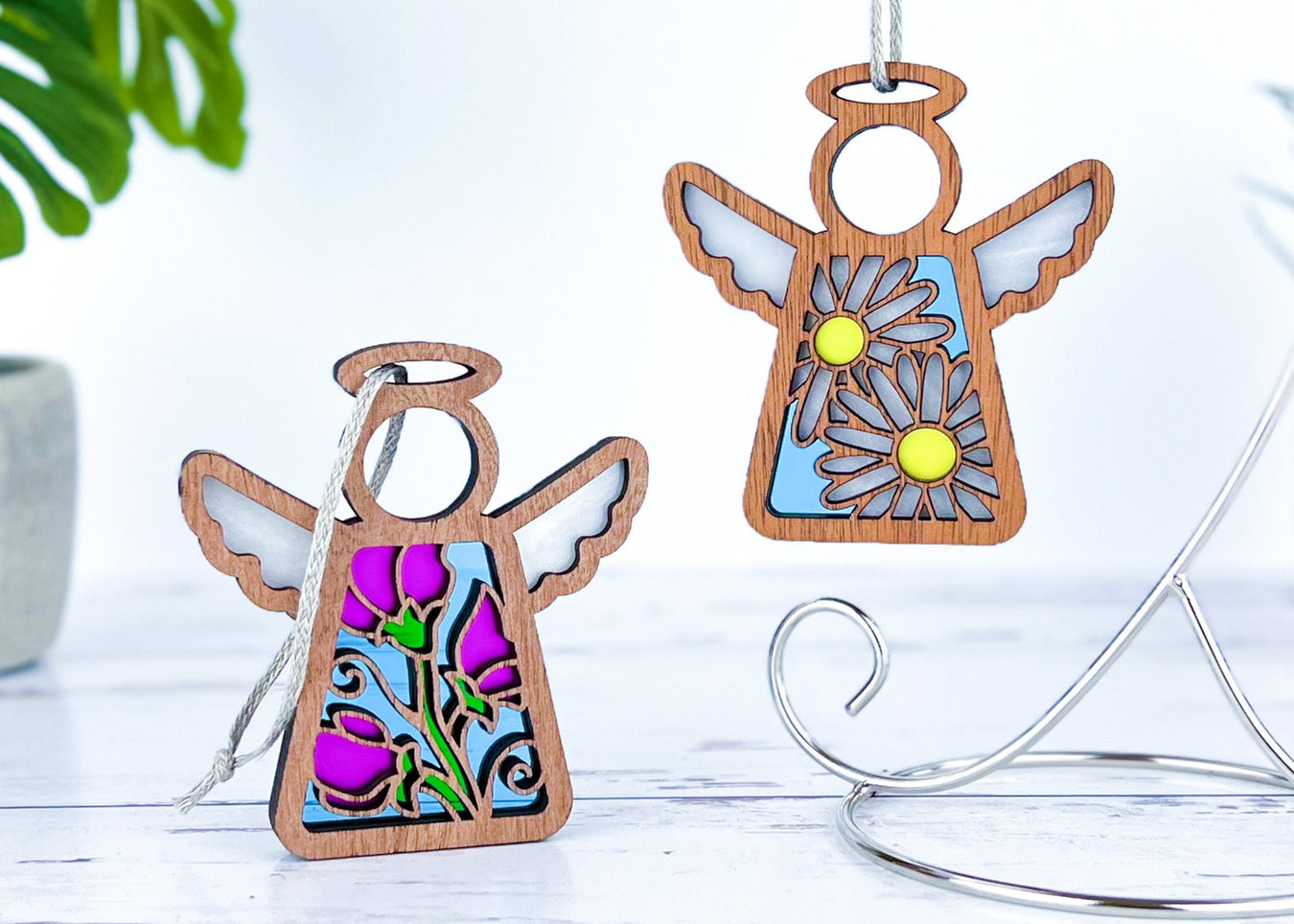 Angel ornaments featuring April birth month flowers, ideal birthday gift ideas for a wife, best friend or special women, showcasing vibrant sweet pea and daisy birth flowers in a stained glass inspired style.