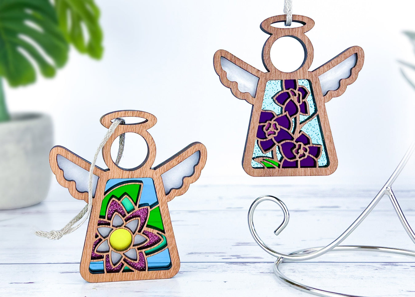 Angel ornaments featuring July birth month flowers, ideal birthday gift ideas for a wife, best friend or special women, showcasing vibrant water lily and larkspur birth flowers in a stained glass inspired style.
