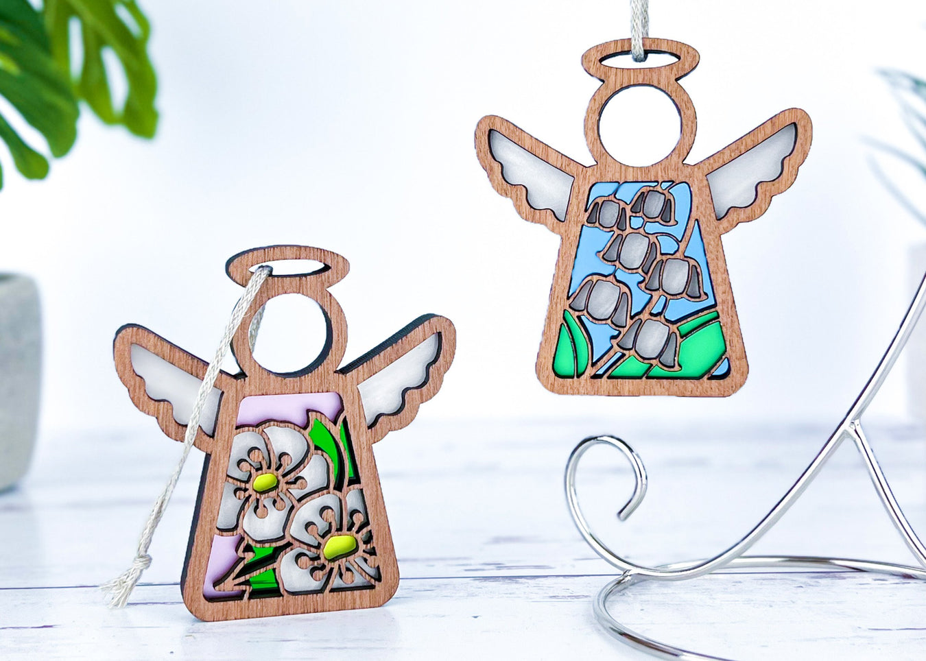 Angel ornaments featuring May birth month flowers, ideal birthday gift ideas for a wife, best friend or special women, showcasing vibrant hawthorn and lily of the valley birth flowers in a stained glass inspired style.