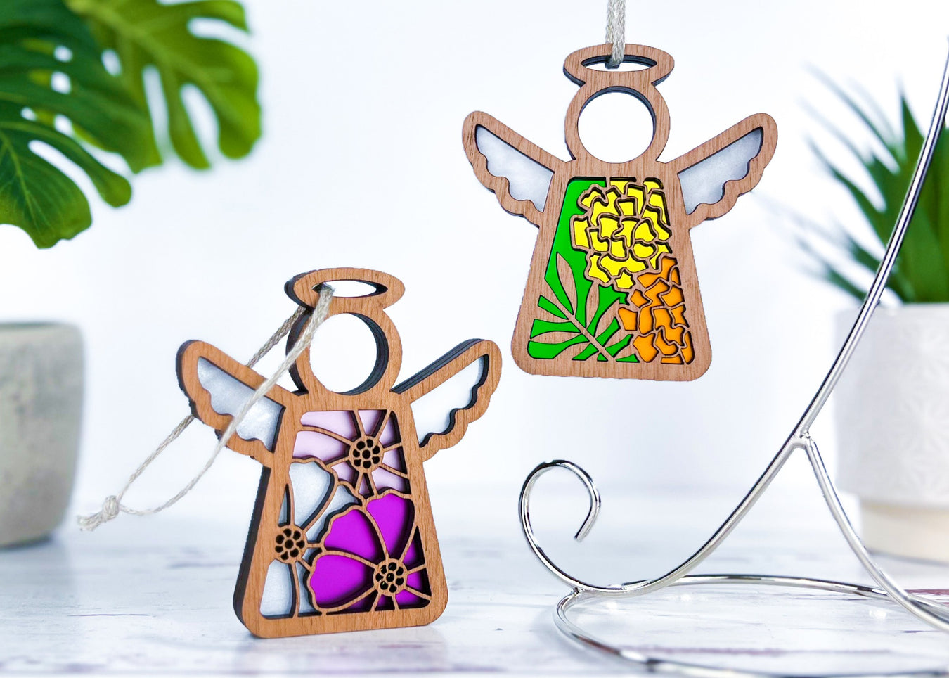 Angel ornaments featuring October birth month flowers, ideal birthday gift ideas for a wife, best friend or special women, showcasing vibrant cosmos and marigold birth flowers in a stained glass inspired style.