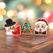 Snowman with cardinal, Christmas tree, and Santa ornaments on a wooden table, a Christmas ornament gift set