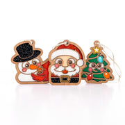 Christmas Cuties bundle: snowman and cardinal, Santa, and smiling Christmas tree ornaments, a cute stocking stuffer gift set