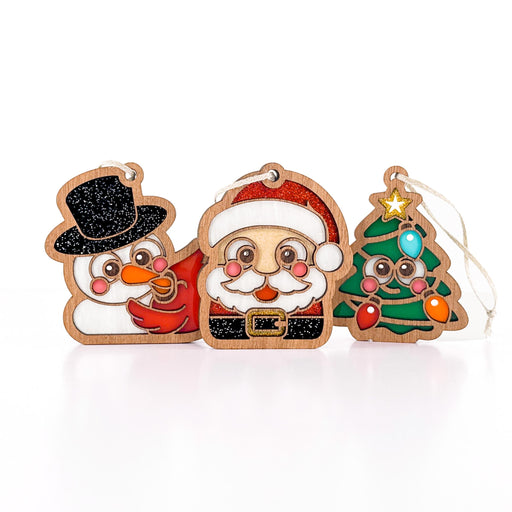 Christmas Cuties bundle: snowman and cardinal, Santa, and smiling Christmas tree ornaments, a cute stocking stuffer gift set