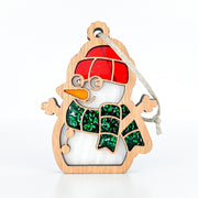The Forged Flare® Christmas Snowman Ornament, 3.6" tall, features glasses, a carrot nose, red hat, green scarf, shiny accents, and a hanging loop—a delightful gift or festive tree decoration.
