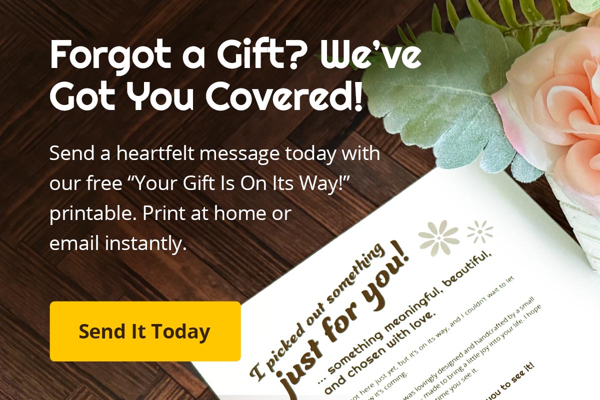 Promotional graphic for a free printable gift message with flowers on a wooden surface.