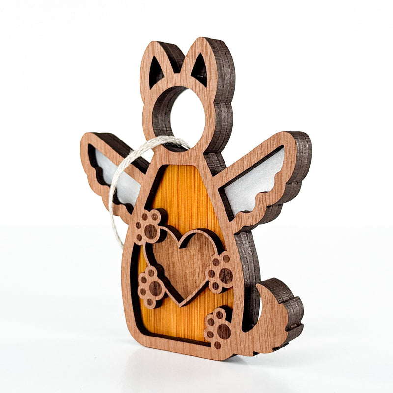The Forged Flare® Forever By My Side Dog Angel Ornament features a layered wood angelic dog with wings, heart cutout, paw prints, and hanging loop—perfect as a heartfelt pet memorial or gift for any dog lover.