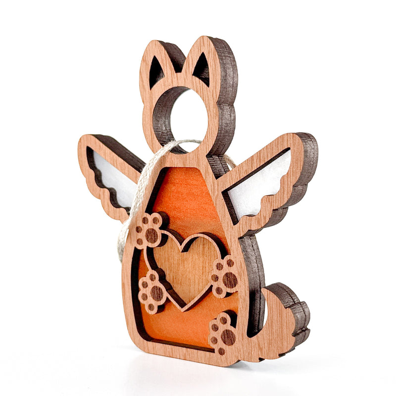 The Forged Flare® Forever By My Side Dog Angel Ornament features a wooden dog with wings, a heart, and paw prints, plus orange accents and a string for hanging—perfect as a dog lover gift or thoughtful dog memorial.