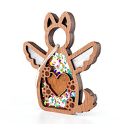 The Forged Flare® Forever By My Side Dog Angel Ornament is a wooden dog-shaped angel with wings, a heart cutout filled with colorful confetti and florals, plus a white hanging string—a perfect gift for any pet lover.