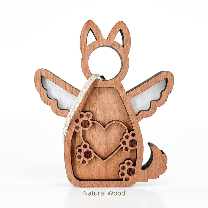 The Forever By My Side Dog Angel Ornament by Forged Flare® is a wooden ornament with pointed ears, wings, heart and paw prints, plus a hanging loop. A charming dog lover gift or personalized keepsake for any pet parent. Text reads "Natural Wood".