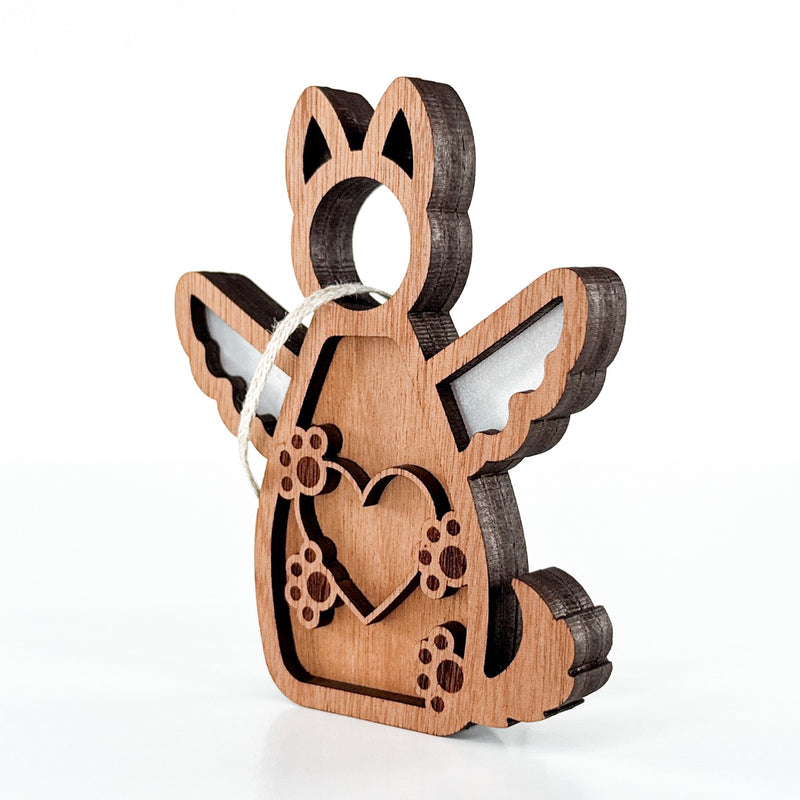 The Forged Flare® Forever By My Side Dog Angel Ornament features a layered, laser-cut wooden dog with heart and paw cutouts, complete with twine for hanging—perfect as a memorial or gift for dog lovers.