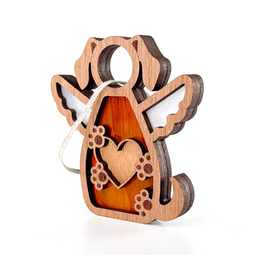 The Forged Flare® Forever In My Heart Dog Angel Ornament is a wooden dog-shaped decoration with angel wings, heart and paw cutouts, and a hanging loop—perfect as a personalized gift for dog moms. Photographed against a white background.