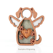 The Forged Flare® Forever In My Heart Dog Angel Ornament features a wooden design with wings, paw prints, a heart engraved with "Bella", and a top string. Perfect as a dog mom gift. Text reads "Example of Engraving".
