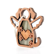The Forged Flare® Forever In My Heart Dog Angel Ornament features layered wood, angel wings, a heart, and paw prints. Includes hanging string—ideal as a personalized gift for dog moms or dog lovers. Shown on a white background.
