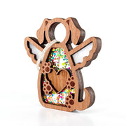 The Forged Flare® Forever In My Heart Dog Angel Ornament is a heartfelt gift for dog lovers, featuring an angel shape with dog ears and tail, white wings, heart cutout, paw prints, colorful confetti inside, and a hanging string.