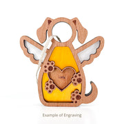 The Forged Flare® Forever In My Heart Dog Angel Ornament features a yellow body, white wings, and an engraved heart reading "Lucy." This personalized dog mom gift includes a hanging string. Text reads "Example of Engraving".