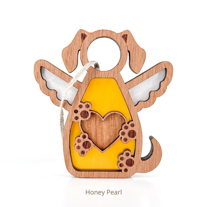 The Forged Flare® Forever In My Heart Dog Angel Ornament is a wooden angel dog with wings, a yellow center, heart and paw print cutouts, and a hanging string—perfect as a dog lover gift or memorial. Text reads "Honey Pearl".