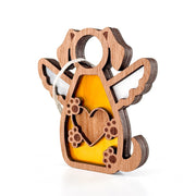 The Forged Flare® Forever In My Heart Dog Angel Ornament features a wooden dog with angel wings, heart cutout, yellow acrylic accents, and hanging string. A thoughtful personalized gift for dog lovers. Shown on a plain white background.