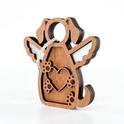 The Forged Flare® Forever In My Heart Dog Angel Ornament features winged dog design, cutout heart and paw prints, and hanging string. Ideal as a personalized pet ornament or thoughtful gift for dog lovers. Background is white.
