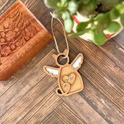 The Forged Flare® Forever Loved Cat Angel Ornament for Charity, with white wings and a heart engraved "Missing since you gained your wings," is perfect as a personalized pet keepsake or cat memorial.
