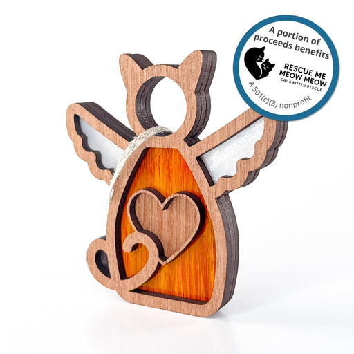 The Forged Flare® Forever Loved Cat Angel Ornament for Charity is a handcrafted cat keepsake with wings and a heart. Sticker text reads "A portion of proceeds benefits Rescue Me Meow Meow Cat and Kitten Rescue. A 501c3 nonprofit".