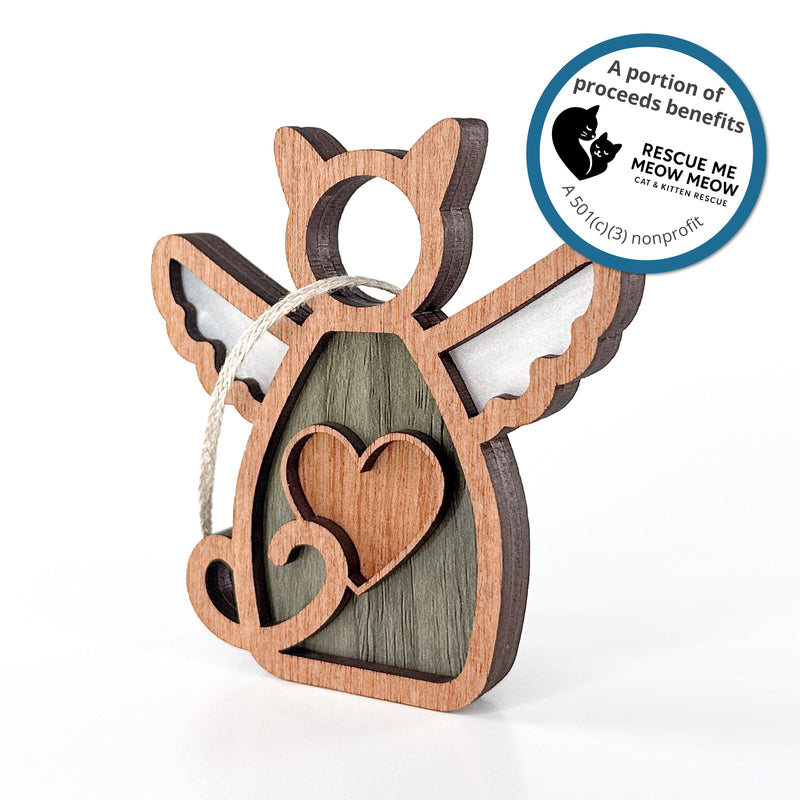 The Forged Flare® Forever Loved Cat Angel Ornament features wings, a heart cutout, and a hanging loop. A portion of proceeds helps Rescue Me Meow Meow Cat & Kitten Rescue, a 501(c)(3) nonprofit.