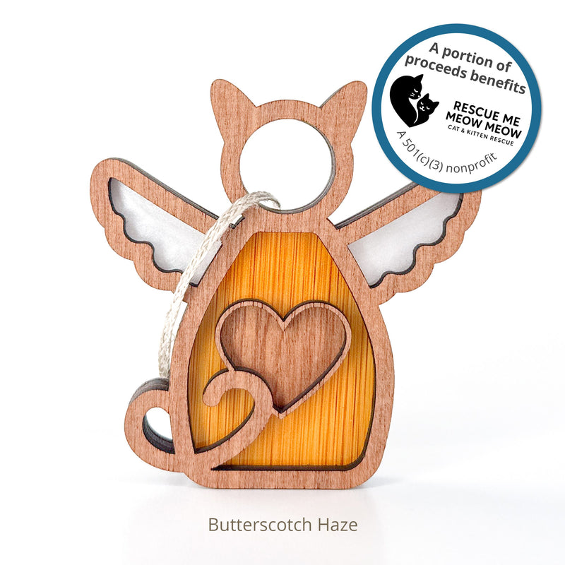 The Forged Flare® Forever Loved Cat Angel Ornament for Charity features a wooden cat shape with wings, cut-out heart, curled tail, and hanging string. Personalized with "Butterscotch Haze." Proceeds support Rescue Me Meow Meow.