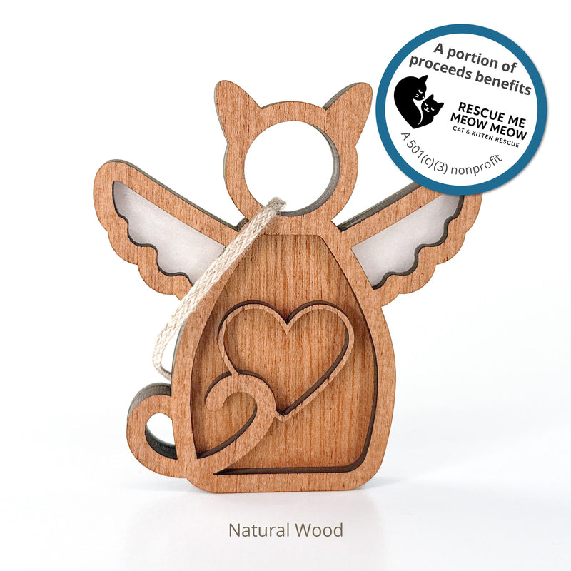The Forged Flare® Forever Loved Cat Angel Ornament for Charity is a natural wood cat-shaped decoration with wings, heart outline, and hanging loop. Proceeds benefit Rescue Me Meow Meow, a cat and kitten rescue nonprofit.