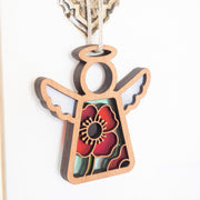 Forged Flare® Warehouse Return - Poppy Ornament: 3.5" wooden Mother's Angels® angel figurine with cut-out wings and a bold red poppy design, perfect as a unique marketplace or warehouse return find.