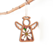 The Forged Flare® Mother's Angels® Dogwood Ornament is a 3.5" wooden angel figurine, featuring a delicate dogwood flower design, hanging by a string against a plain white background.
