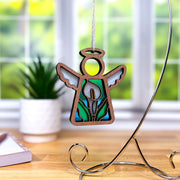 The Forged Flare® Calla Lily Ornament is a 3.5" stained glass-style angel figurine from the Mother's Angels® line, perfect as a unique Christmas tree decoration or thoughtful gift.