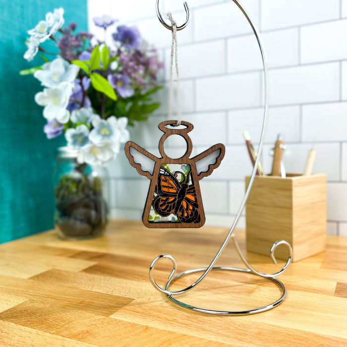 A Mother’s Angels® ornament by Forged Flare®, showcasing a Monarch butterfly, which is often associated with hope and transformation, elegantly hanging as a part of butterfly decorations for a birthday, or as a meaningful sympathy gift alternative to flowers.