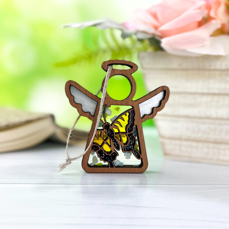 A Forged Flare® Warehouse Return - Swallowtail Butterfly Ornament | 3.5" Mother’s Angels® figurine with stained-glass wings and yellow butterfly details stands on a white surface—ideal for gifting or finding on Amazon.