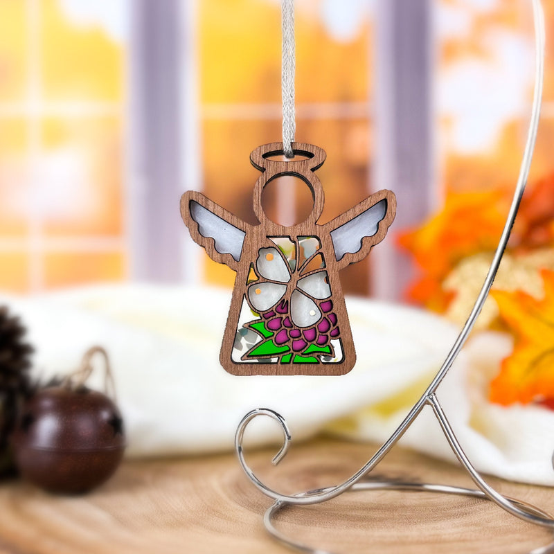 The Forged Flare® Cabbage Butterfly with Clover Flower Ornament is a 3.5" angel figurine from the Mother's Angels® line, featuring stained glass-style details—a charming gift for collectors and fans of angel decor.