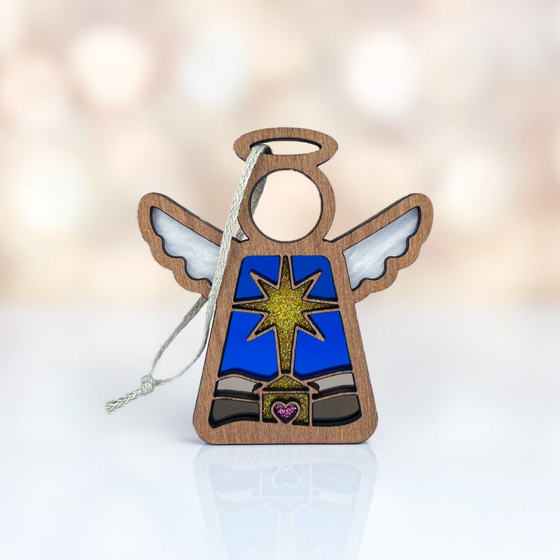 The Mother's Angels® Christmas Nativity Star with Imperfections 3.5" Angel Figurine by Forged Flare® features silver wings, a pink heart, and a blue-gold star—a charming holiday decoration or thoughtful gift for the season.