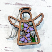 The Forged Flare® Playful Purple Butterflies Ornament with Imperfections is a 3.5" Mother's Angels® wooden angel figurine, featuring cutout purple butterflies and green leaves, perfect for hanging or display on any surface.
