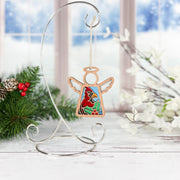 The Forged Flare® Winter Cardinal Ornament with Imperfections is a 3.5" Mother's Angels® stained glass angel figurine, featuring a cardinal centerpiece and displayed on a silver stand for a festive touch.