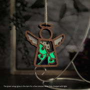 The Luna Moth Ornament by Forged Flare® is a 3.5" wooden angel figurine with glowing green and blue wings, perfect as a unique Christmas tree ornament from the Mother's Angels® collection.