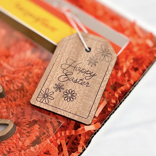 Handcrafted wooden Happy Easter gift tag for an Easter gift basket that features an intricate detail.