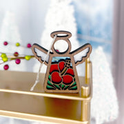 The Forged Flare® Hibiscus Ornament | 3.5" (H) Angel Figurine by Mother's Angels® features wood, cut-out wings, and red hibiscus stained glass, hanging by a white string—perfect for adding Hawaiian charm to your Christmas décor.