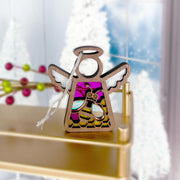 The Forged Flare® Warehouse Return - Honey Bee Ornament is a 3.5" stained glass-style Mother's Angels® figurine featuring pink, purple, and gold accents. It sits on a gold shelf—a lovely Amazon marketplace find for festive decor.