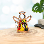 The Warehouse Return - Ruby-Throated Hummingbird Ornament by Forged Flare® is a 3.5" Mother’s Angels® figurine with stained glass-style wings and a hummingbird among red flowers, sourced from our returned Amazon inventory.
